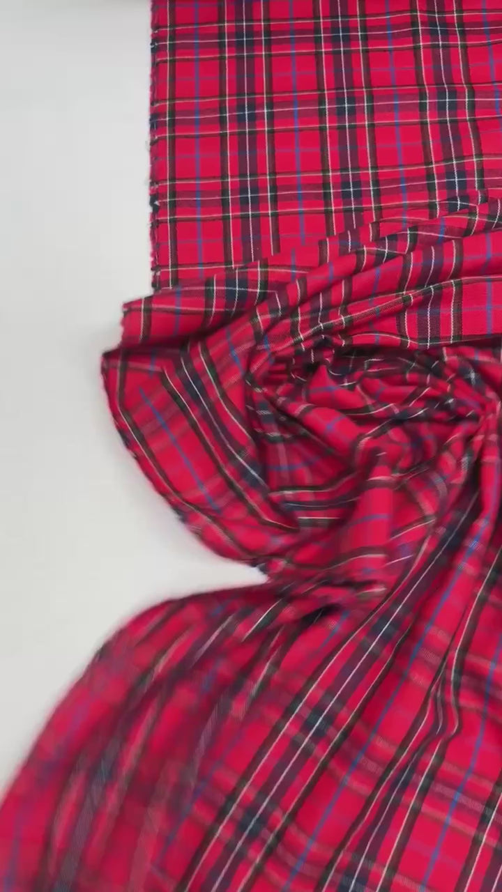 Italian cotton flannel fabric in bright red and black plaid, lightweight textile for shirts, blouses, and casual wear.