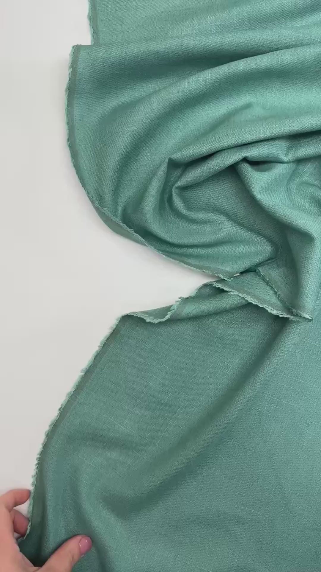Linen Blend Shirting fabric in aqua blue-green color. Made from 78% Linen and 22% Rayon/Viscose. Ideal for shirts and blouses.