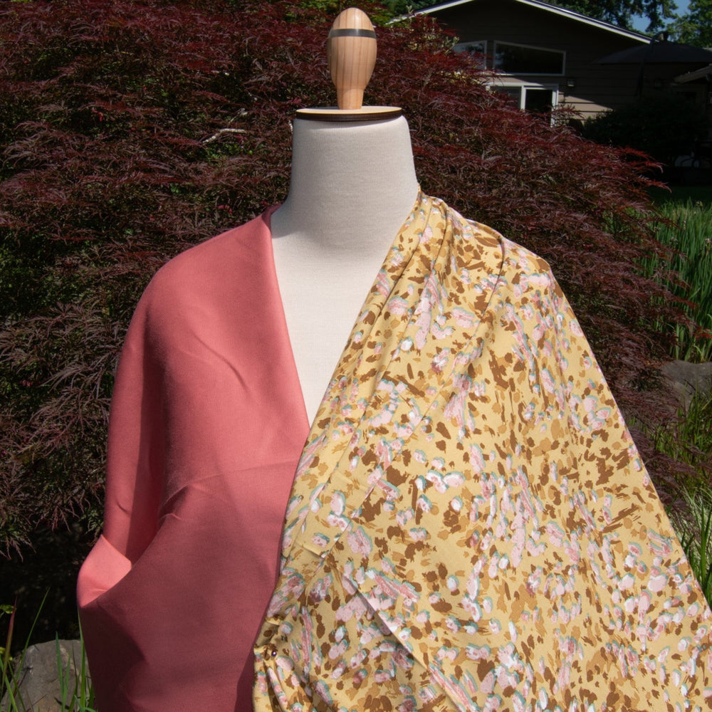 Rayon Challis fabric in buttery caramel abstract pattern, 56-inch wide, lightweight and flowing, ideal for dresses and blouses.
