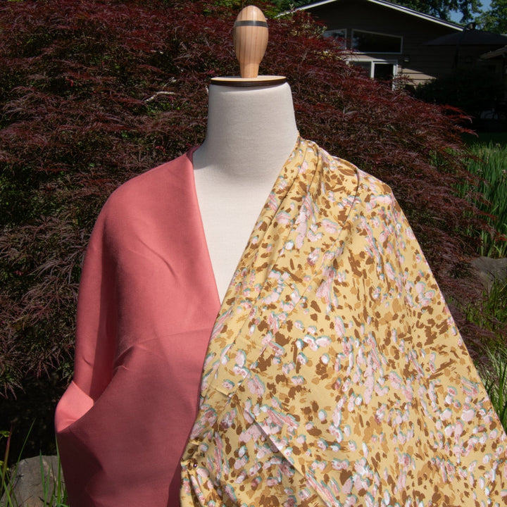 Rayon Challis fabric in buttery caramel abstract pattern, 56-inch wide, lightweight and flowing, ideal for dresses and blouses.