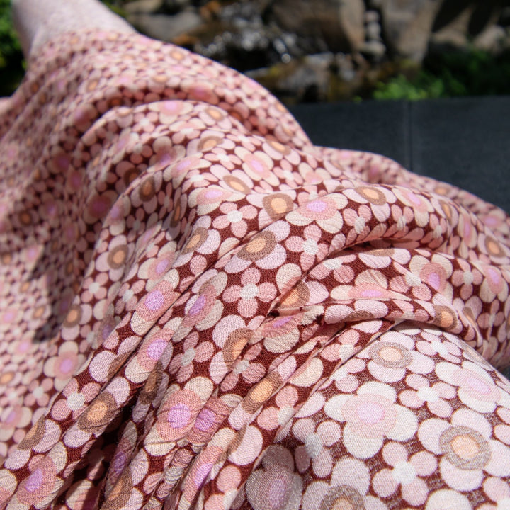 Rayon Crepe fabric in wine color with symmetrical apricot and blush mod floral pattern, 52 inches wide, ideal for sewing dresses and blouses
