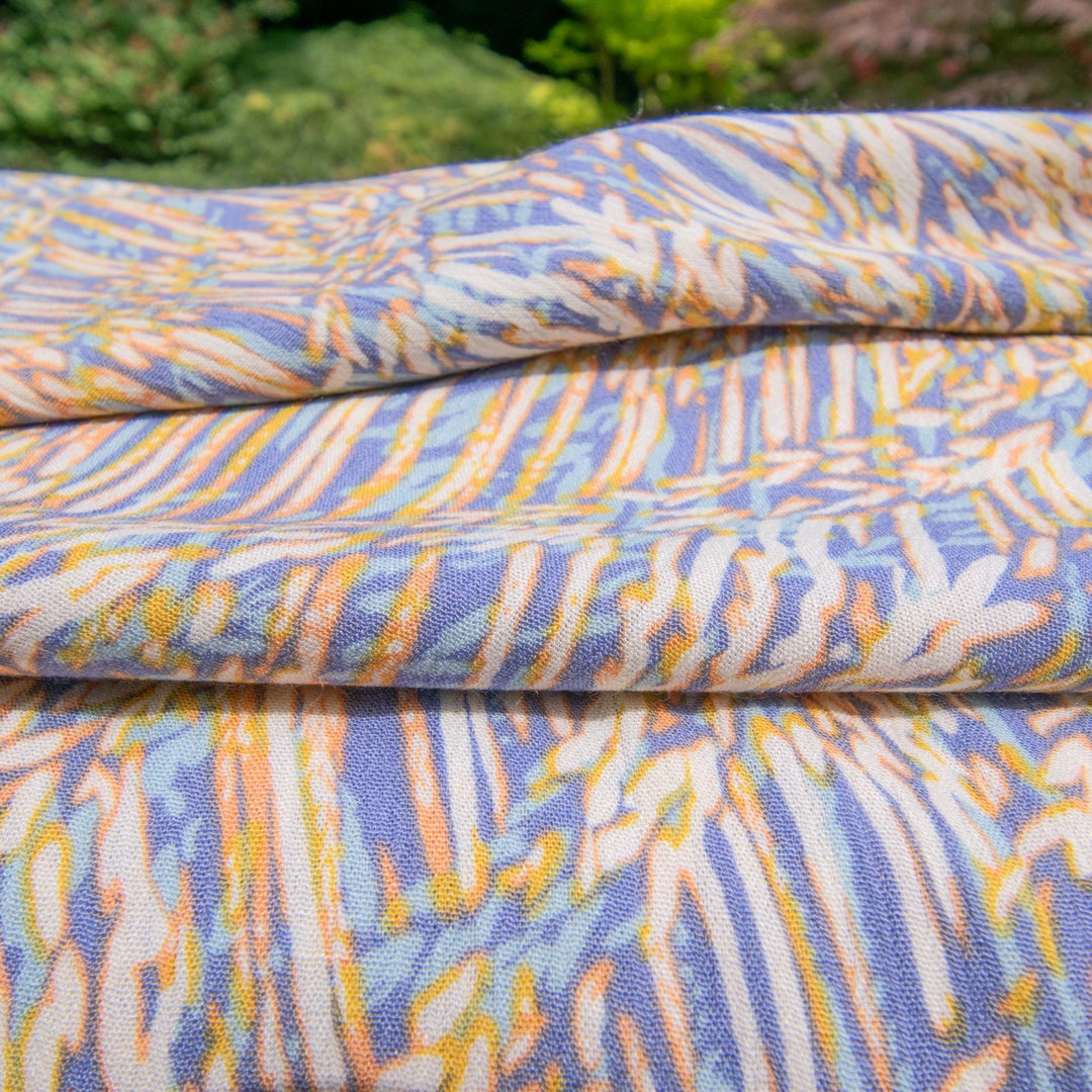 Rayon Crepe Blues Cream Abstract fabric with flowing drape