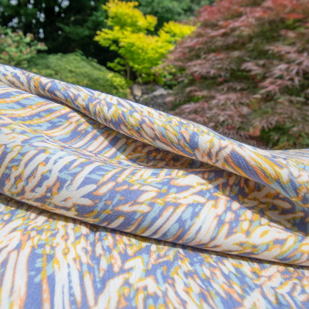 Rayon Crepe Blues Cream Abstract fabric with flowing drape