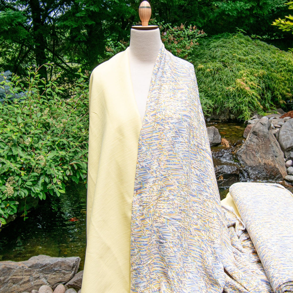 Rayon Crepe Blues Cream Abstract fabric with flowing drape