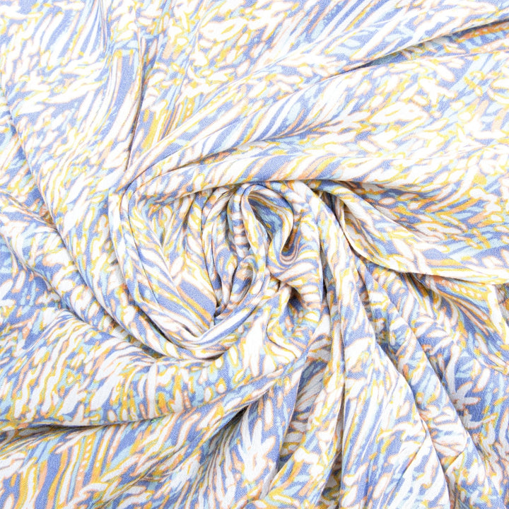 Rayon Crepe Blues Cream Abstract fabric with flowing drape