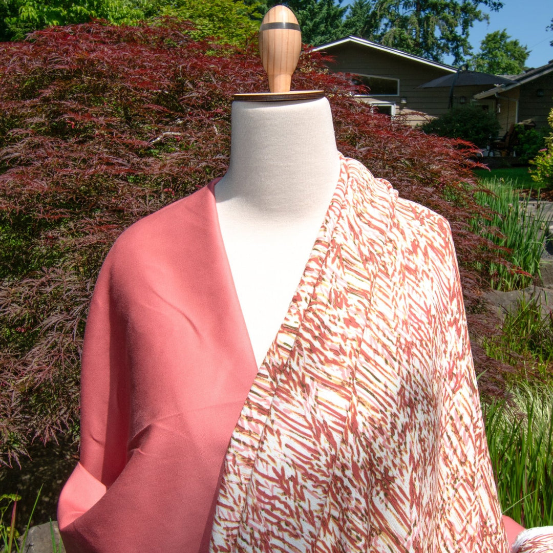 Rayon Crepe fabric in berries, pink, and caramel abstract print on cream, soft flowing textile for dressmaking and skirts
