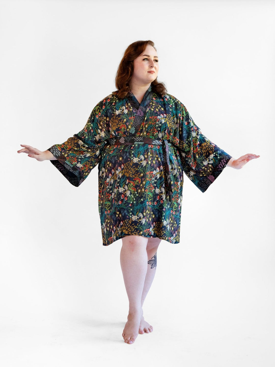 Signature Robe in "Secret Garden" print, navy floral kimono-style bathrobe, lightweight rayon fabric with cotton edgings.
